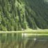 Man fly fishing on a mountain lake