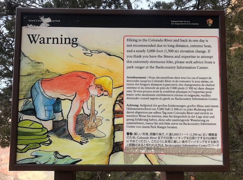 warning sign for hikers in the Grand Canyon saying not to hike to the bottom and back in one day